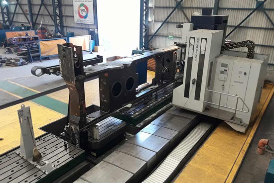 Large CNC machine finishing a heavy steel weldment
